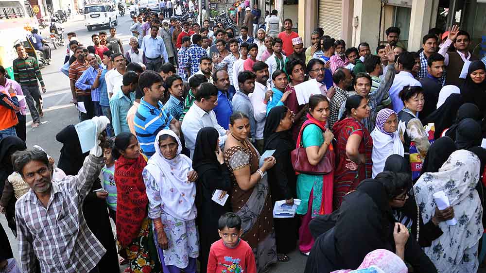 Crowd at a bank's branch in MI Road. Photo credit