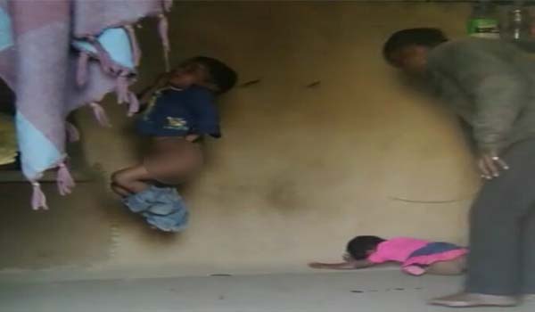 Video grab of father abusing children rajasthan