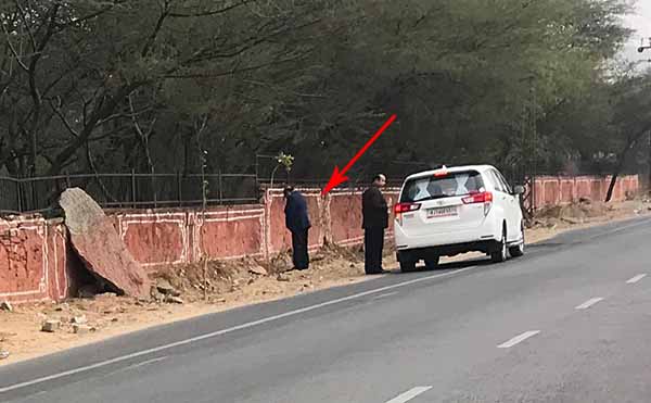 Kalicharan saraf urinating on the roadside